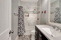 full bathroom featuring vanity, toilet, and shower / bath combo with shower curtain