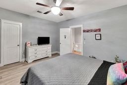 bedroom featuring ceiling fan and light wood-type flooring