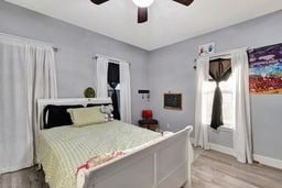 bedroom featuring ceiling fan and light hardwood / wood-style flooring