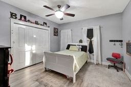 bedroom featuring ceiling fan and light wood-type flooring