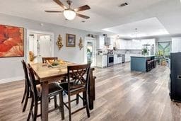 dining room featuring hardwood / wood-style flooring and ceiling fan