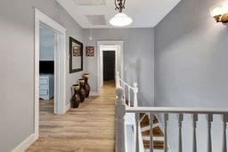 hall with light hardwood / wood-style flooring