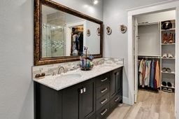 bathroom with hardwood / wood-style floors and vanity