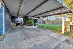 view of patio / terrace featuring a carport