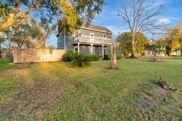 view of yard featuring a balcony