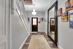 doorway to outside with dark hardwood / wood-style floors