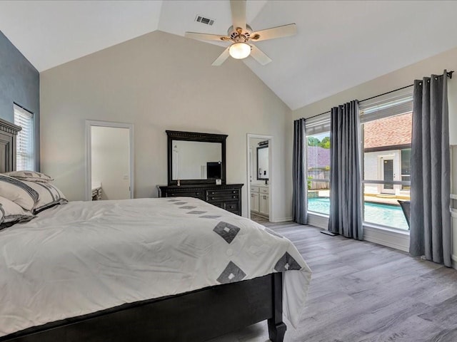 bedroom featuring access to exterior, ceiling fan, high vaulted ceiling, light hardwood / wood-style flooring, and connected bathroom