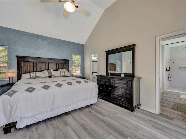 bedroom featuring ensuite bathroom, ceiling fan, light hardwood / wood-style floors, and multiple windows