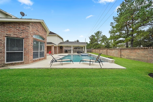 view of pool featuring a patio and a yard