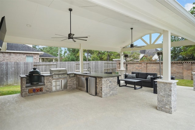 view of patio with a grill, area for grilling, sink, ceiling fan, and an outdoor living space