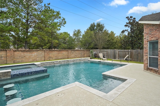 view of pool featuring an in ground hot tub and a patio area