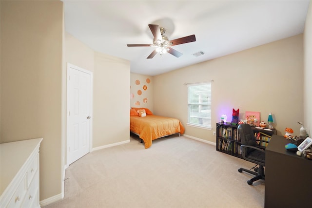 bedroom featuring light carpet and ceiling fan