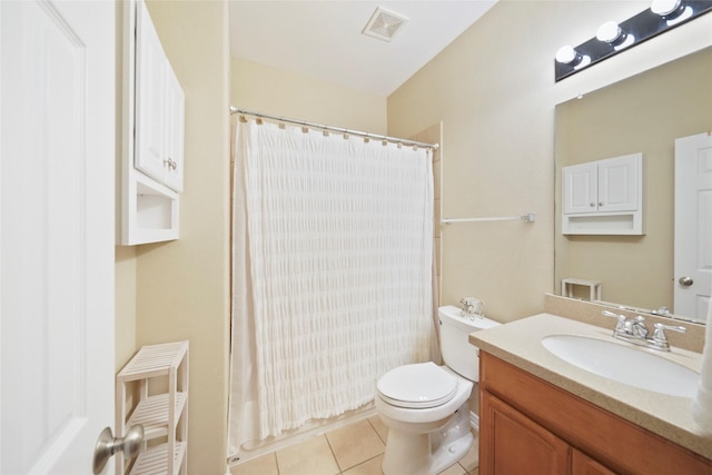 bathroom featuring tile patterned floors, toilet, and vanity