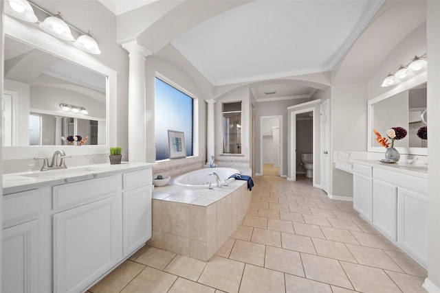 bathroom featuring vanity, tile patterned floors, ornamental molding, and decorative columns