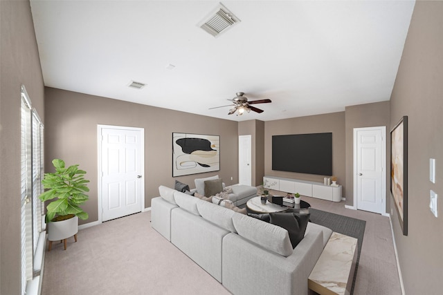 living room with ceiling fan and light carpet