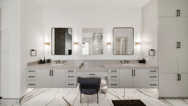 bathroom with an enclosed shower and vanity