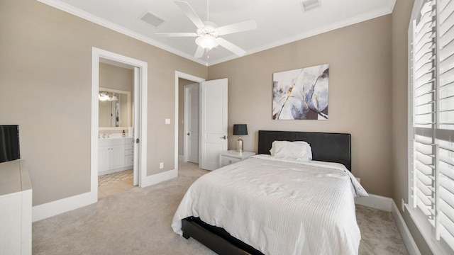 carpeted bedroom with ensuite bathroom, ceiling fan, and ornamental molding