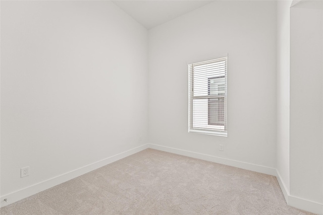 unfurnished room with light colored carpet