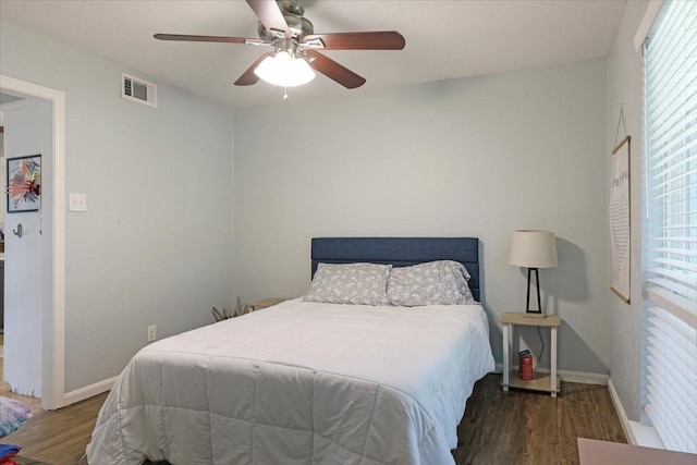 bedroom featuring dark hardwood / wood-style floors and ceiling fan