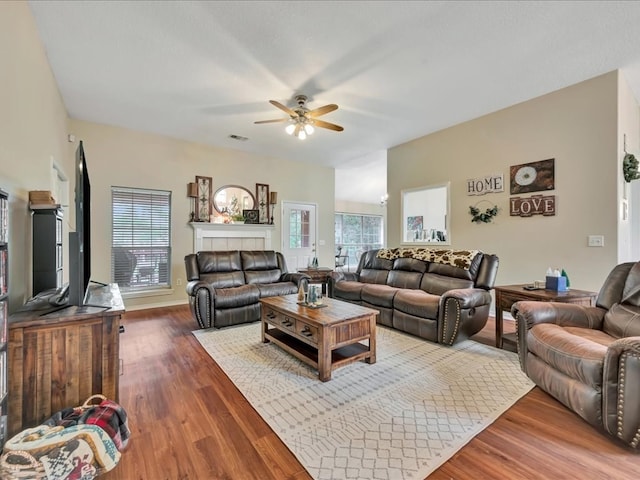 living room with ceiling fan and hardwood / wood-style floors