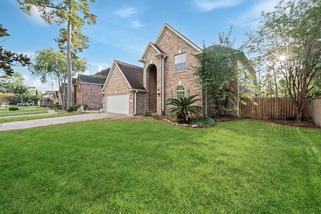 front of property featuring a garage and a front lawn