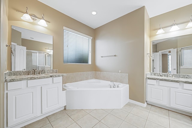 bathroom with tile patterned flooring, vanity, and independent shower and bath