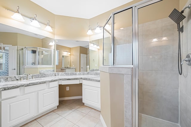 bathroom with vanity, tile patterned floors, and walk in shower