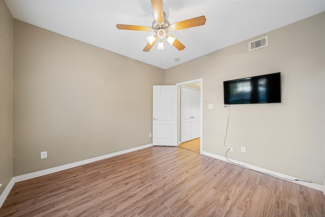 unfurnished bedroom featuring ceiling fan and light hardwood / wood-style flooring