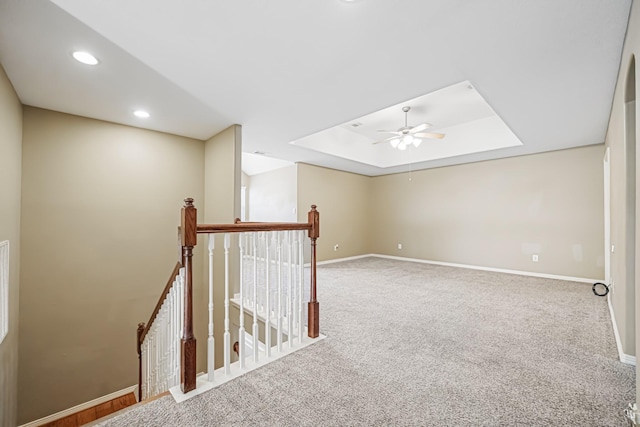 bonus room featuring ceiling fan and carpet