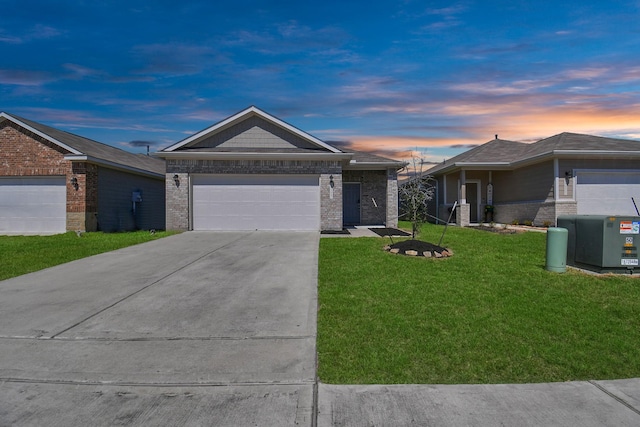 view of front of house with a lawn and a garage