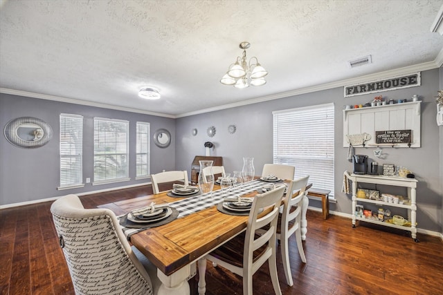 dining room featuring crown molding, dark hardwood / wood-style floors, an inviting chandelier, and a textured ceiling