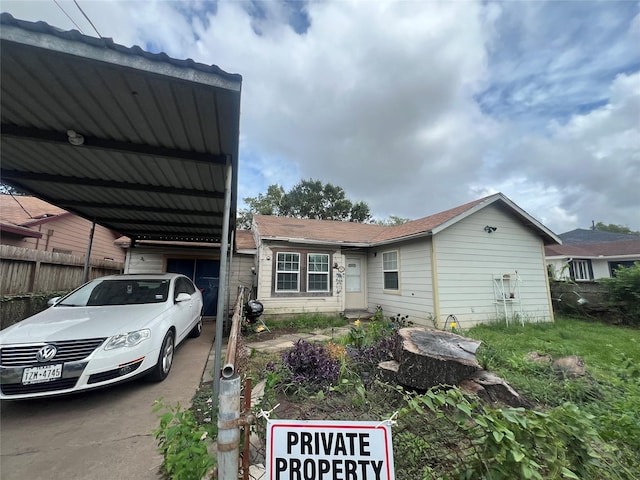 view of property exterior with a carport