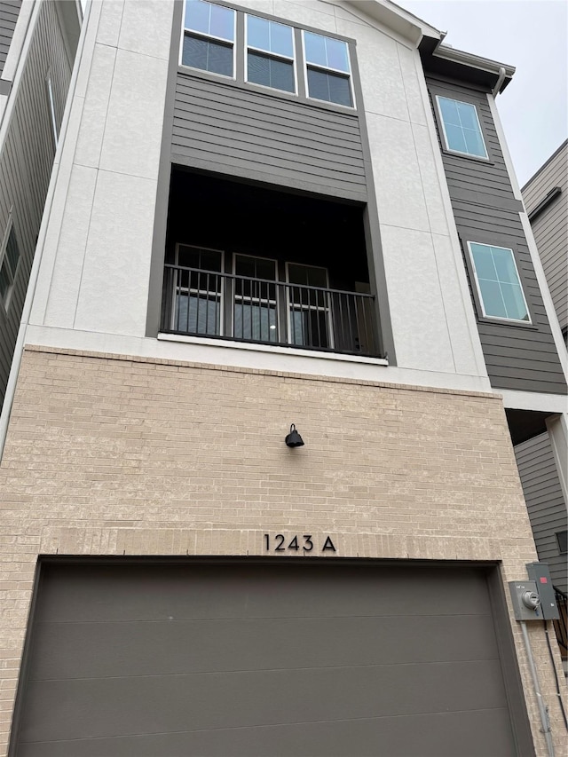 view of side of home featuring a garage