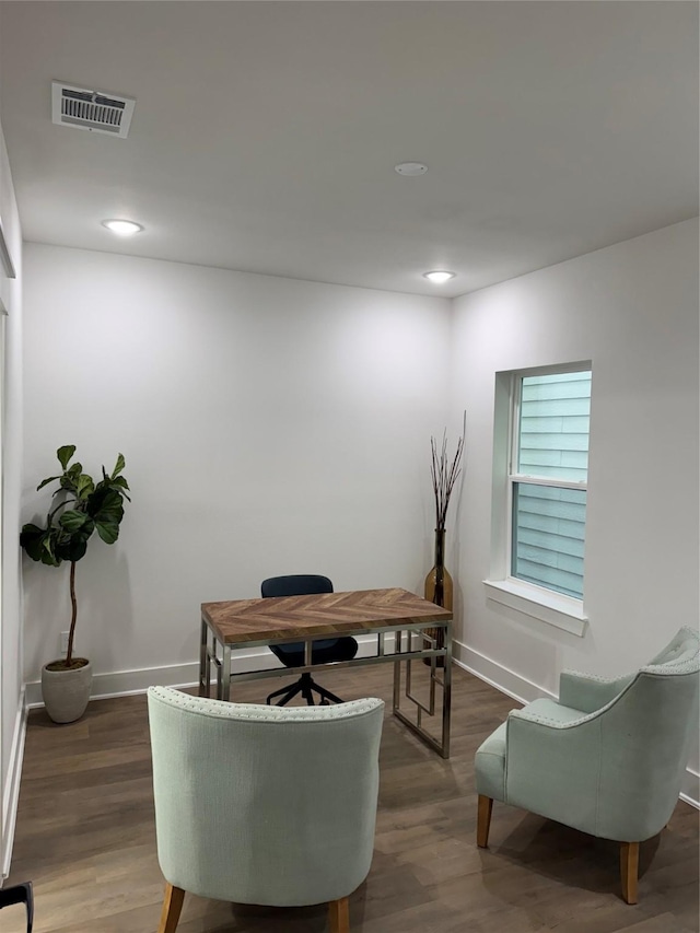 home office with dark wood-type flooring