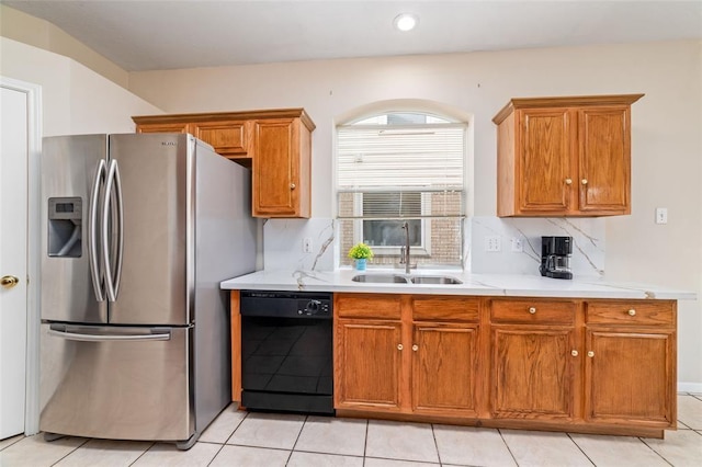 kitchen with sink, decorative backsplash, black dishwasher, light tile patterned flooring, and stainless steel fridge with ice dispenser