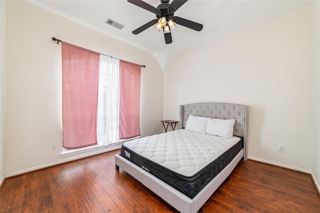 bedroom featuring dark hardwood / wood-style flooring and ceiling fan