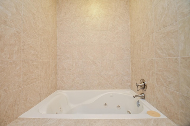 bathroom featuring tiled bath