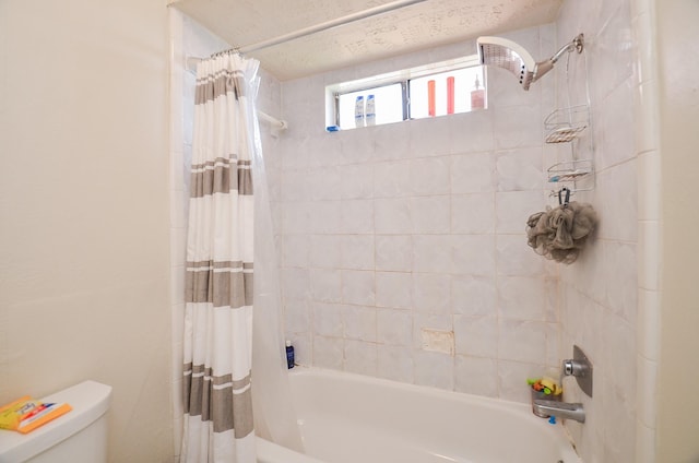 bathroom with toilet and shower / tub combo with curtain