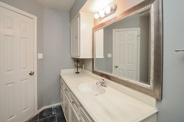 bathroom featuring tile patterned flooring and vanity