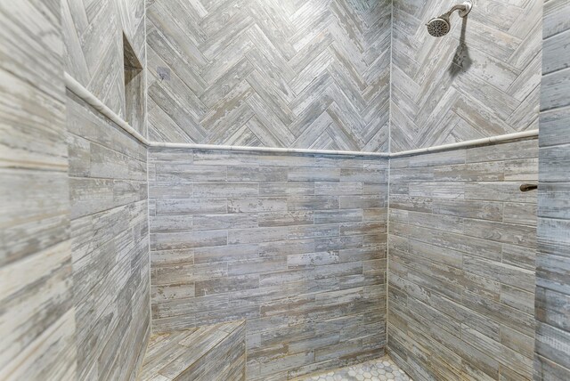 bathroom with tiled shower