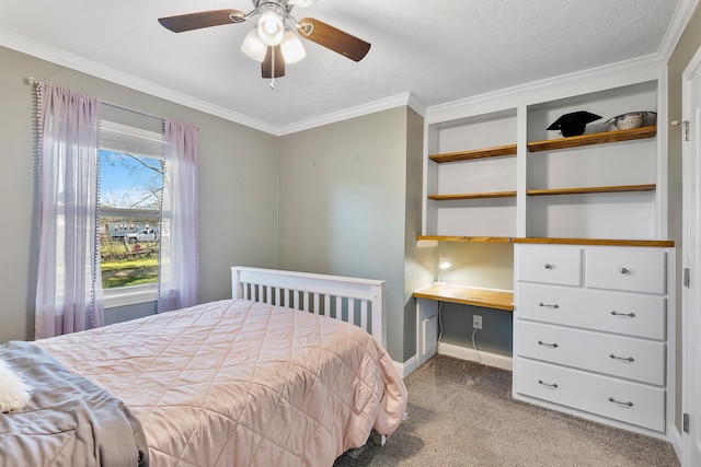 carpeted bedroom featuring a textured ceiling, ceiling fan, and ornamental molding