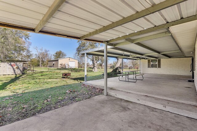 view of patio featuring a storage shed