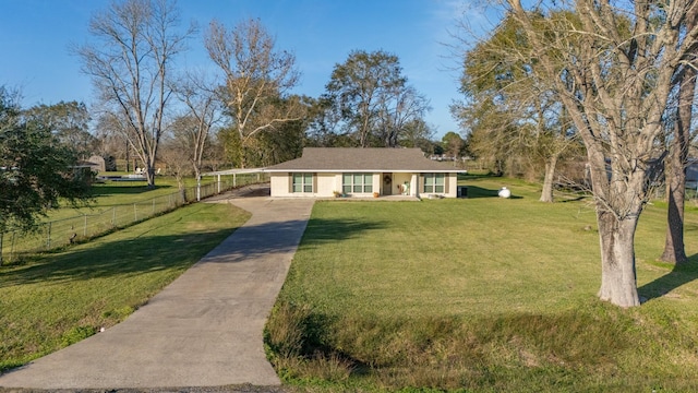 ranch-style home featuring a front yard and a carport