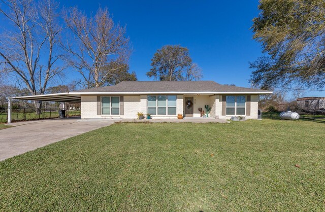 single story home with a carport and a front lawn