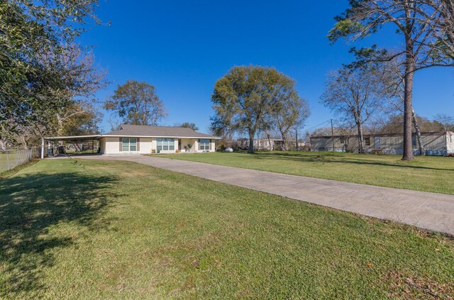 ranch-style home with a front lawn and a carport