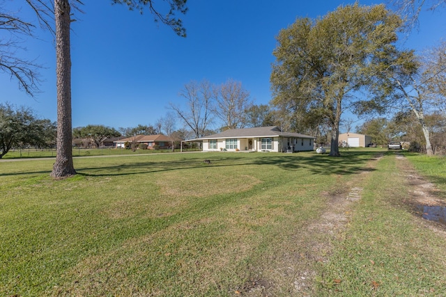 ranch-style home with a front yard