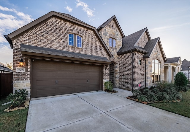 view of front of property with a garage