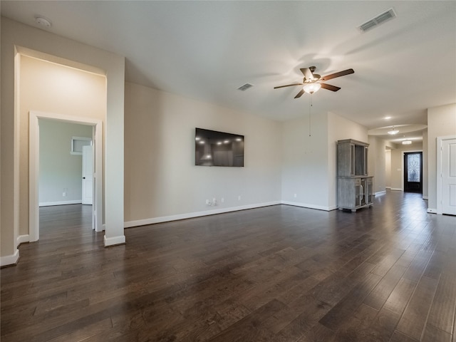 unfurnished living room with dark wood-type flooring and ceiling fan