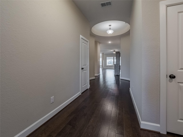 hall with dark hardwood / wood-style floors