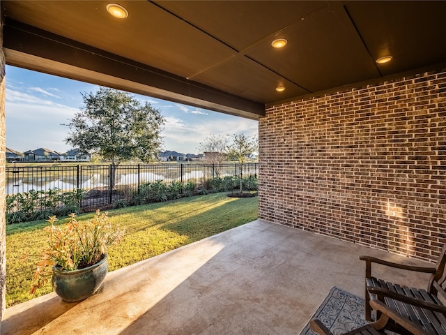 view of patio with a water view